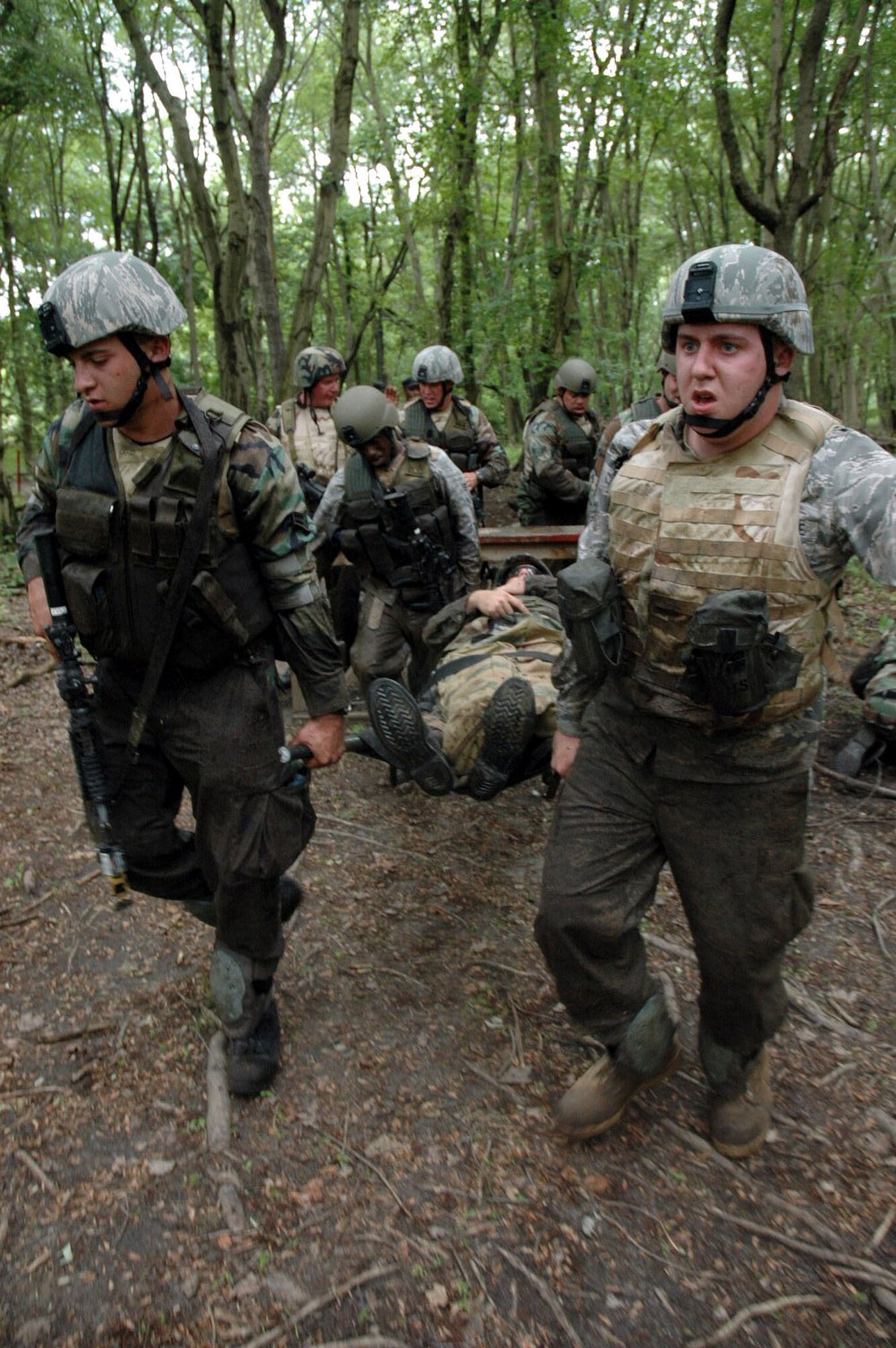 Students in the Air Force Phoenix Warrior Training Course 08-5 participate in a combat first aid class on a Fort Dix, N.J., range June 5, 2008.  The course is taught by the U.S. Air Force Expeditionary Center's Expeditionary Operations School and 421st Combat Training Squadron and prepares security forces Airmen for upcoming deployments. Annually, the USAF EC trains more than 23,000 students in expeditionary- and mobility air force-based courses both with in-residence and distance learning.  (U.S. Air Force Photo/Staff Sgt. Paul R. Evans)