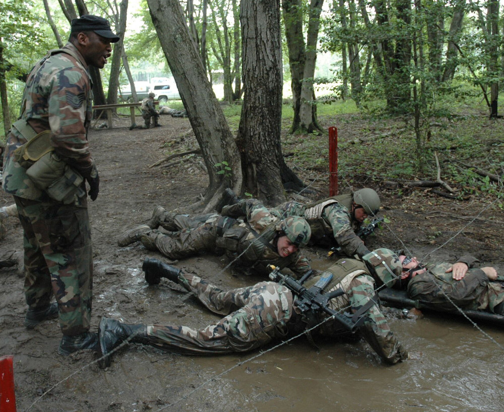 Students in the Air Force Phoenix Warrior Training Course 08-5 participate in a combat first aid class on a Fort Dix, N.J., range June 5, 2008.  The course is taught by the U.S. Air Force Expeditionary Center's Expeditionary Operations School and 421st Combat Training Squadron and prepares security forces Airmen for upcoming deployments. Annually, the USAF EC trains more than 23,000 students in expeditionary- and mobility air force-based courses both with in-residence and distance learning.  (U.S. Air Force Photo/Staff Sgt. Paul R. Evans)