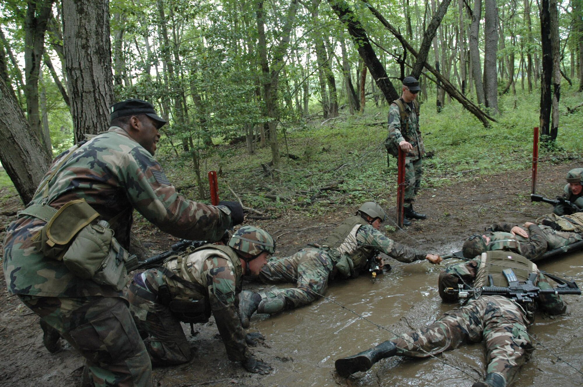 Students in the Air Force Phoenix Warrior Training Course 08-5 participate in a combat first aid class on a Fort Dix, N.J., range June 5, 2008.  The course is taught by the U.S. Air Force Expeditionary Center's Expeditionary Operations School and 421st Combat Training Squadron and prepares security forces Airmen for upcoming deployments. Annually, the USAF EC trains more than 23,000 students in expeditionary- and mobility air force-based courses both with in-residence and distance learning.  (U.S. Air Force Photo/Staff Sgt. Paul R. Evans)