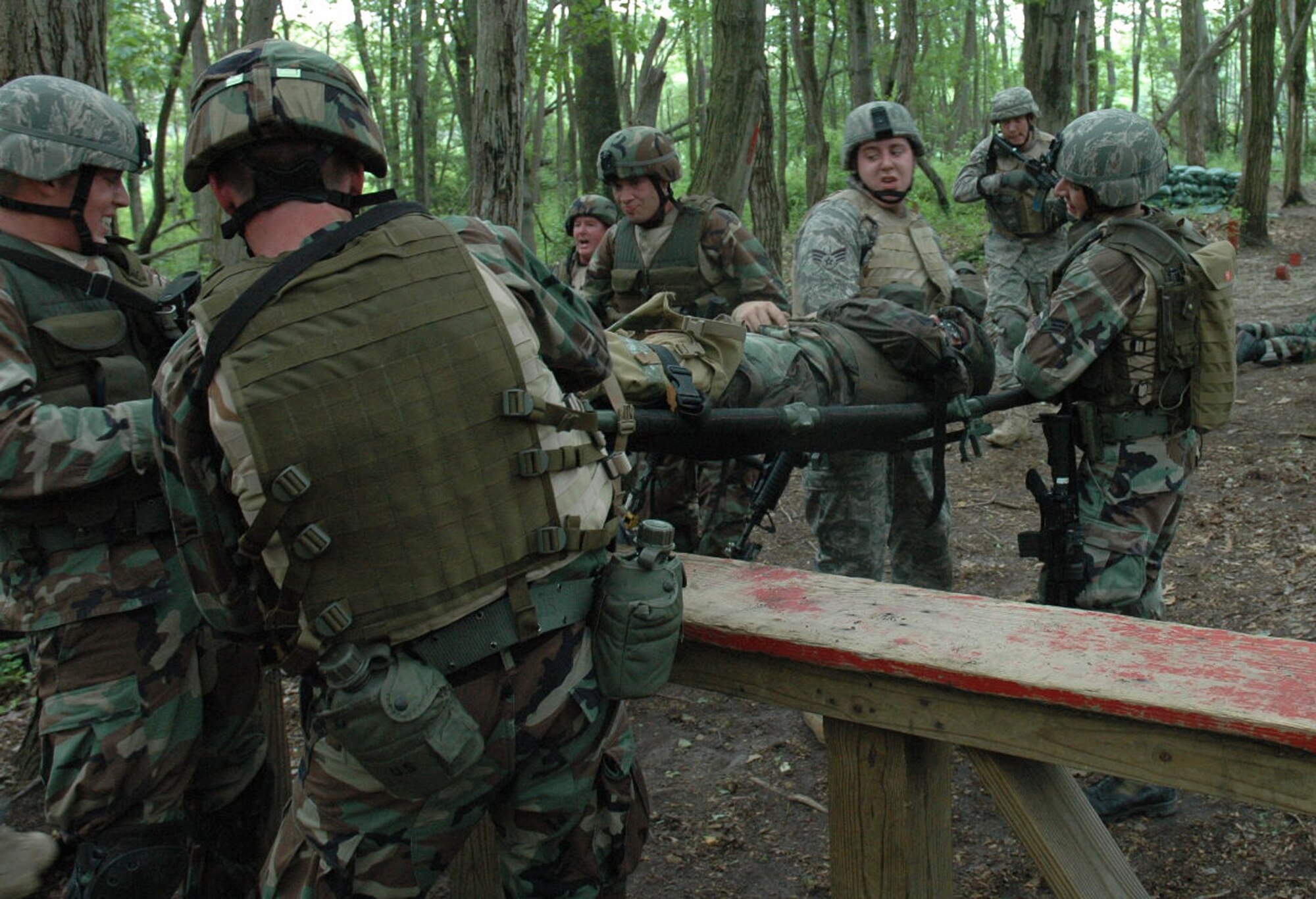 Students in the Air Force Phoenix Warrior Training Course 08-5 participate in a combat first aid class on a Fort Dix, N.J., range June 5, 2008.  The course is taught by the U.S. Air Force Expeditionary Center's Expeditionary Operations School and 421st Combat Training Squadron and prepares security forces Airmen for upcoming deployments. Annually, the USAF EC trains more than 23,000 students in expeditionary- and mobility air force-based courses both with in-residence and distance learning.  (U.S. Air Force Photo/Staff Sgt. Paul R. Evans)