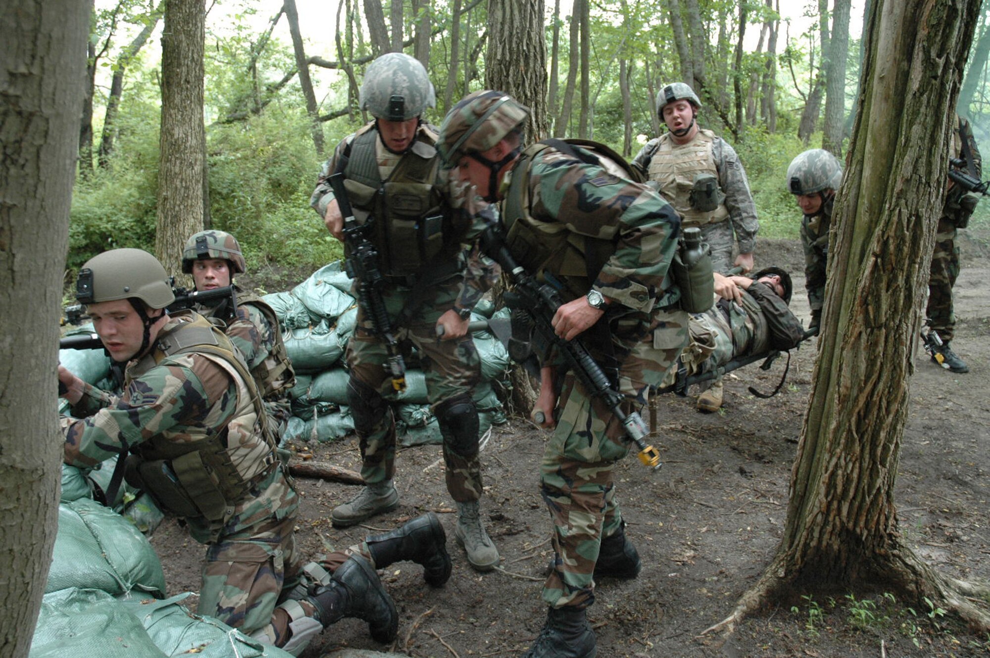 Students in the Air Force Phoenix Warrior Training Course 08-5 participate in a combat first aid class on a Fort Dix, N.J., range June 5, 2008.  The course is taught by the U.S. Air Force Expeditionary Center's Expeditionary Operations School and 421st Combat Training Squadron and prepares security forces Airmen for upcoming deployments. Annually, the USAF EC trains more than 23,000 students in expeditionary- and mobility air force-based courses both with in-residence and distance learning.  (U.S. Air Force Photo/Staff Sgt. Paul R. Evans)