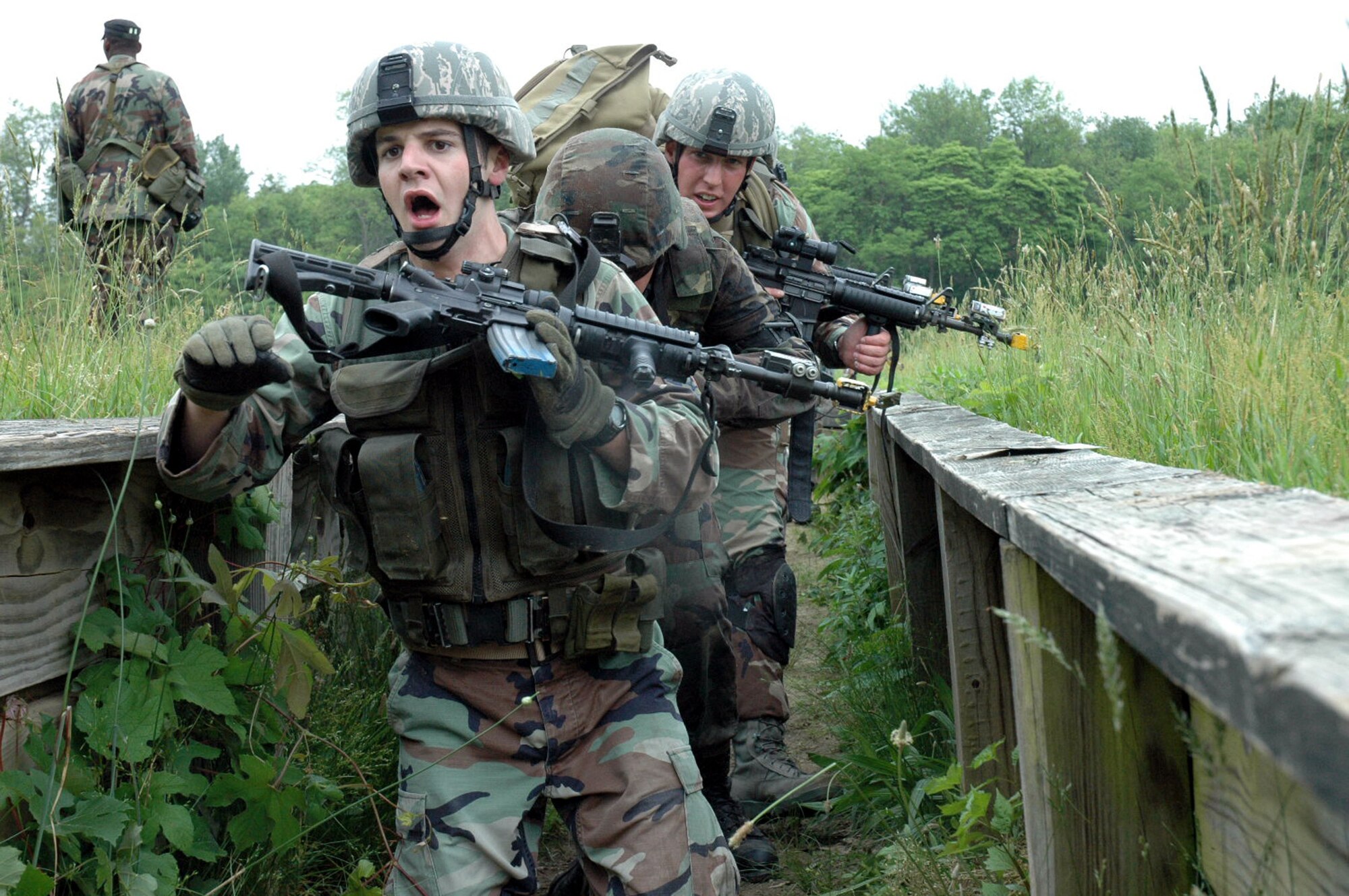 Students in the Air Force Phoenix Warrior Training Course 08-5 go through an obstacle course for combat first aid training on a range on Fort Dix, N.J., June 5, 2008.  The course, taught by the U.S. Air Force Expeditionary Center's 421st Combat Training Squadron, prepares security forces Airmen for upcoming deployments.  (U.S. Air Force Photo/Staff Sgt. Paul R. Evans)