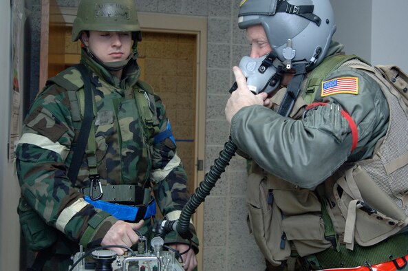 Master Sgt. John "Tex" Austin ensures his life support equipment is working before flying a KC-135 mission during an Operational Readiness Exercise.  Sergeant Austin is a boom operator for the 18th Air Refueling Squadron, the flying squadron of the 931st Air Refueling Group.  Assisting Sergeant Austin is Airman 1st Class Jeff Short from the 22nd Air Refueling Wing, the 931st's host unit at McConnell Air Force Base, Kan.  Airmen from the 931st and 22nd participated in the ORE in April to prepare for an Operational Readiness Inspection scheduled to start June 22. 