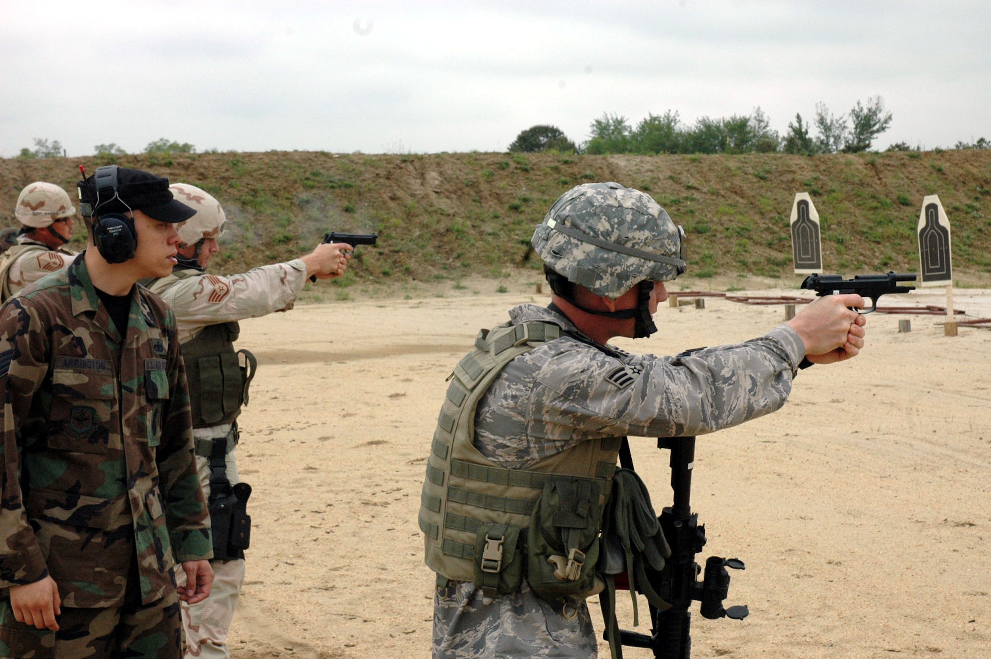 Staff Sgt. Brian Arrington, an instructor from the U.S. Air Force Expeditionary Center's 421st Combat Training Squadron, watches students in the Air Force Phoenix Warrior Training Course 08-5 practice live-fire combat rifle training in a range on Fort Dix, N.J., June 5, 2008.  The course prepares security forces Airmen for upcoming deployments.  Annually, more than 23,000 students are trained at the USAF EC through in-residence and distance learning courses.  (U.S. Air Force Photo/Staff Sgt. Paul Evans)