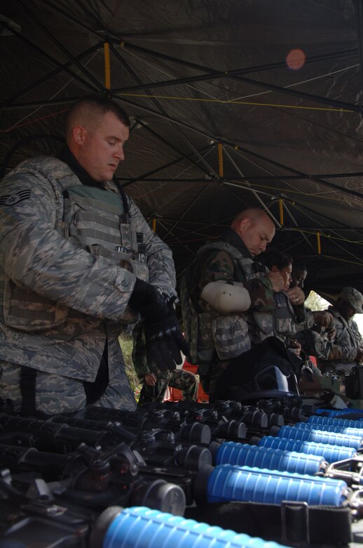 PACAF Security Forces Airmen load ammunition in preparation for the tactical weapons simulation during Commando Warrior at Andy South here, June 14. Commando Warrior is a seven day pre-deployment training exercise specific to PACAF Security Forces Airmen deploying to Kuwait, Iraq, and Afghanistan. (U.S. Air Force photo by Airman First Class Courtney Witt)
