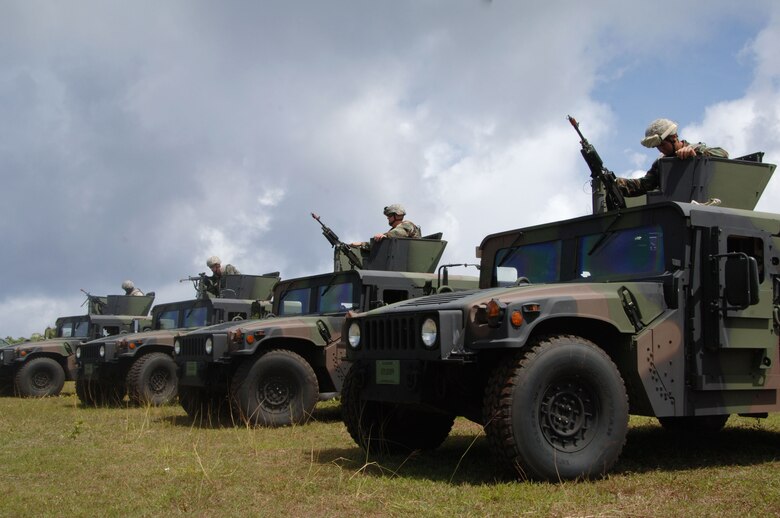 PACAF Security Forces Airmen run through the "driver down drill" inside HUMVEES during Commando Warrior at Andy South on Andersen Air Force Base, June 14. Commando Warrior is a seven day pre-deployment training exercise specific to PACAF Security Forces Airmen deploying to Kuwait, Iraq, and Afghanistan. (U.S. Air Force photo by Airman First Class Courtney Witt)