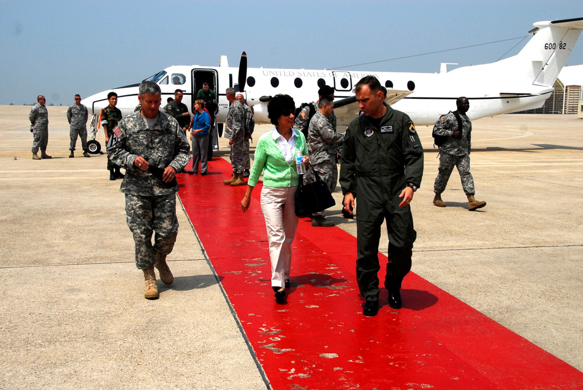 KUNSAN AIR BASE, Republic of Korea -- U.S. Army General Walter Sharp, United States Forces Korea Commander, and his wife Joanne are greeted by Colonel Bryan Bearden, 8th Fighter Wing Commander, upon arrival here June 13.  Gen. Sharp recently took command of USFK and is visiting various areas throughout Korea.  (U.S. Air Force photo/Tech. Sgt. Quinton T. Burris) 