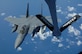 A U.S. Air Force F-15E Strike Eagle from Mountain Home Air Force Base, Idaho, approaches the boom for refueling high above the pacific by a KC-135 Stratotanker from the 117th Air Refueling Squadron, Forbes Field Air National Guard Base, Topeka Kan. Both took off from Andersen Air Force Base, Guam on June 12. (U.S. Air Force photo by Airman 1st Class Courtney Witt)