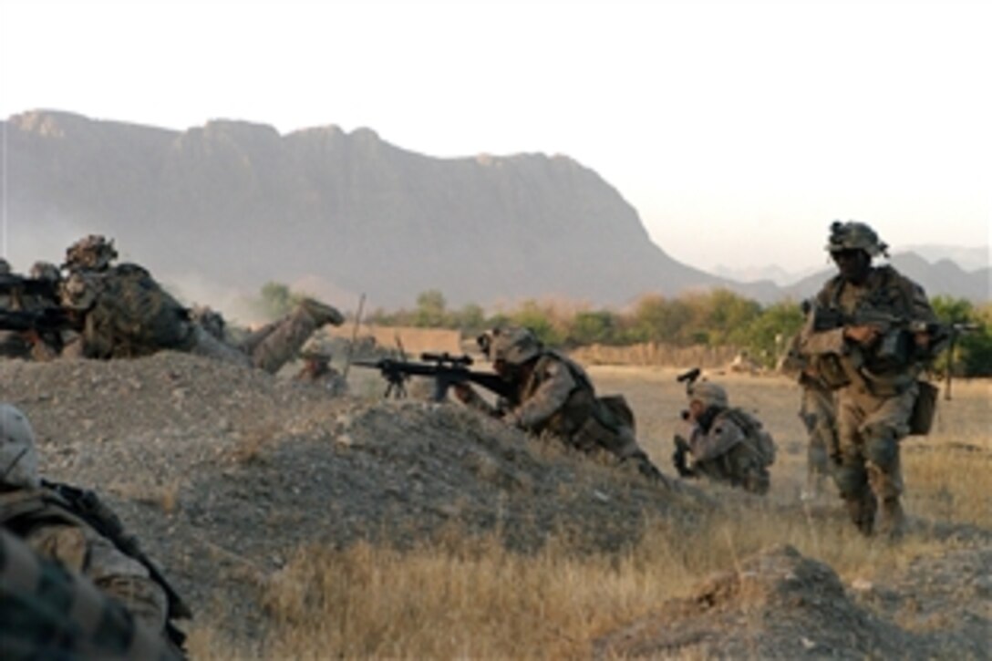 U.S. Marines position themselves before attacking a Taliban stronghold in Now Zad, Afghanistan, June 15, 2008. The Marine are assigned to Foxtrot Company, 2nd Battalion, 7th Marine Regiment. 