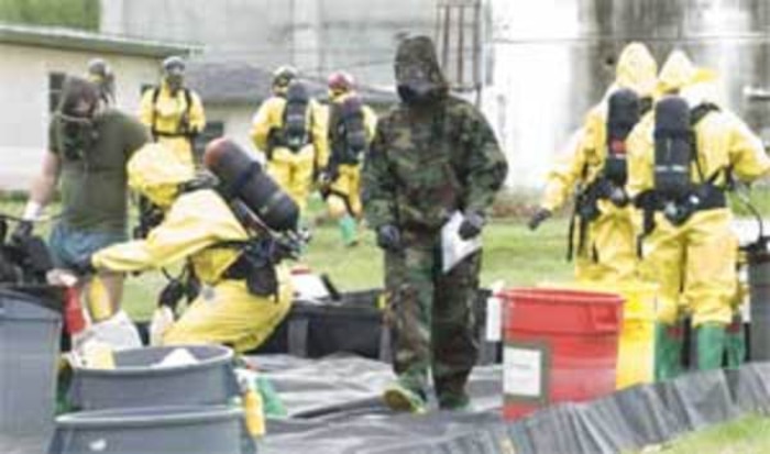 Chemical Biological Incident Response Force (CBIRF) Marines go through a decontamination area during a national level mass casualty drill at Camp Horizon, outside of Bellingham May 6. CBIRF honed their skills this week with members of the local emergency services on casualty search and extraction, decontamination, medical stabilization, and High-Yield explosive consequence management.