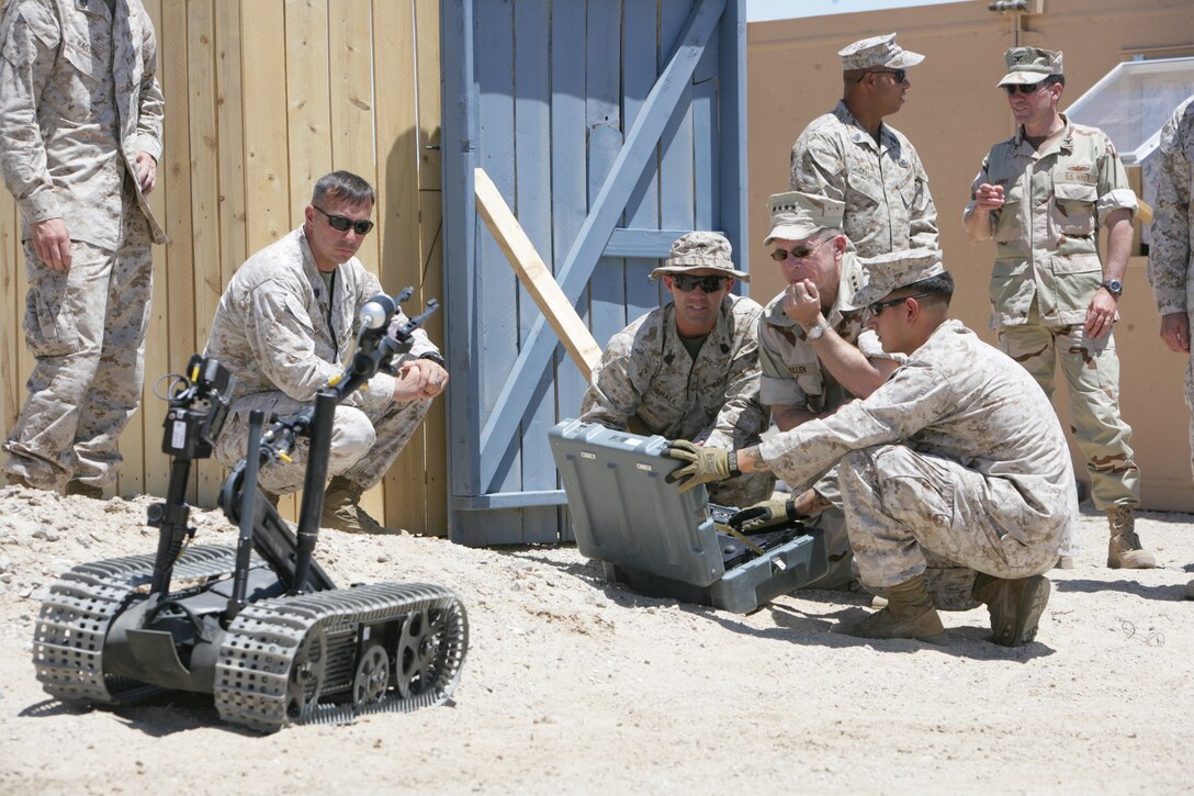 Chairman of the Joint Chiefs of Staff, Adm. Mike Mullen, observes as Explosive Ordnanace Disposal technicians operate the remote controlled Talon Robot at the Combat Center’s Range 051. In addition to visiting EOD, Mullen also visited the Combat Center’s Mojave Viper Exercise and Camp Wilson.