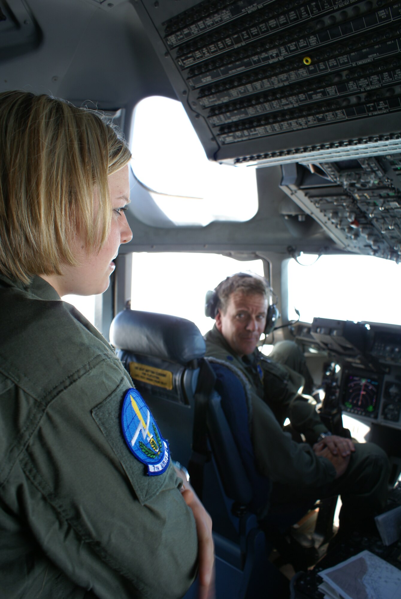 Cadet Third Class Carly Olsowski talks with pilot Lt. Col. Douglas Patterson, 313th AS, during Monday's flight back to McChord. (U.S. Air Force photo/Staff Sgt. Eric Burks)