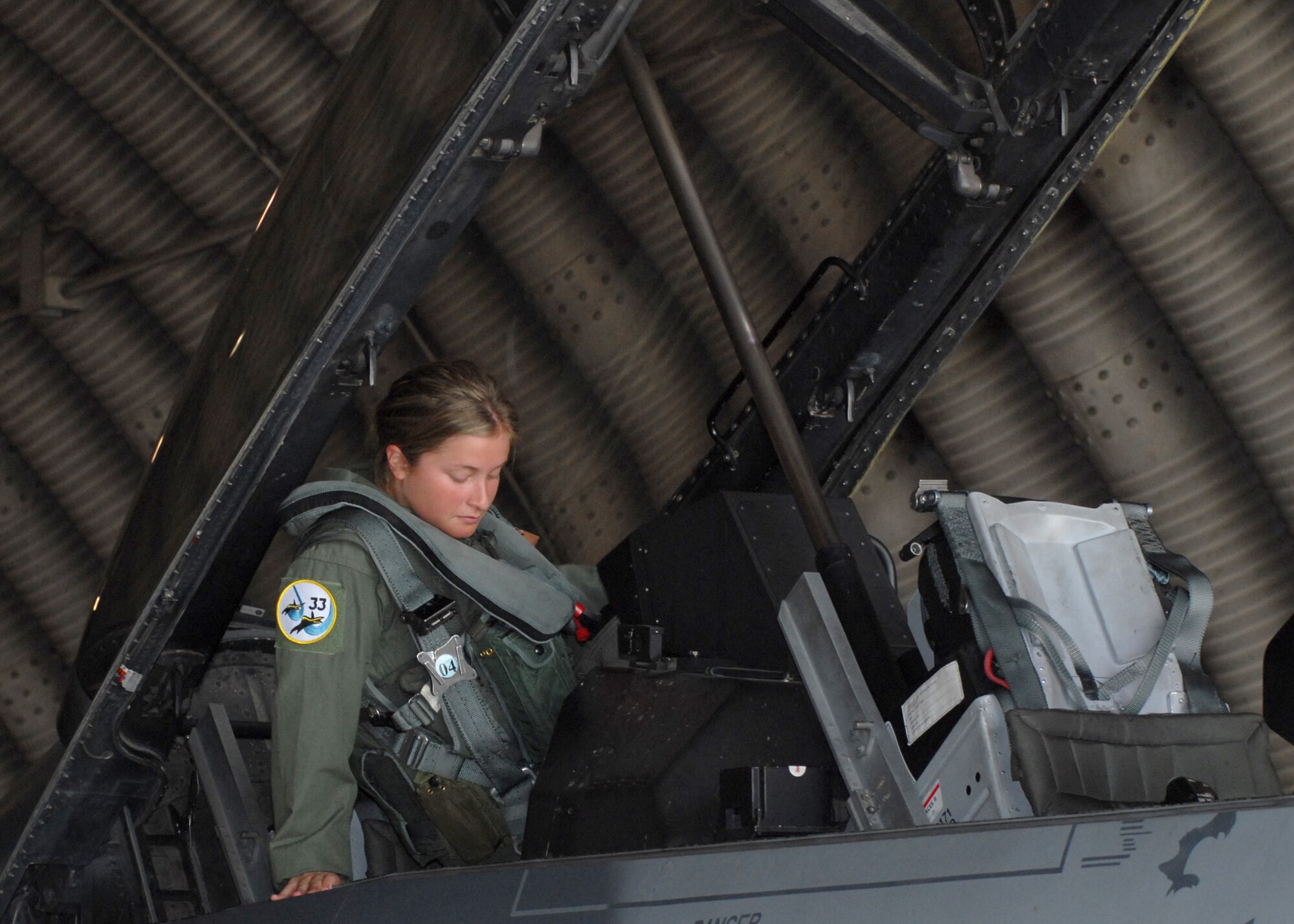 KUNSAN AIR BASE, Republic of Korea — Cadet 2nd Class Lauren Hettich climbs into an F-16D model here June 17. The Operation Air Force program is a three-week program designed to give cadets the opportunity to experience firsthand everything an operational Air Force base has to offer. Cadets are immersed into the Air Force way of life on an Air Force base through the use of tours, receiving hands-on experience, and by shadowing Air Force personnel in a variety of career fields. Ops AF locations include stateside and overseas Air Force bases.  (U.S. Air Force Photo/Staff Sgt Araceli Alarcon)