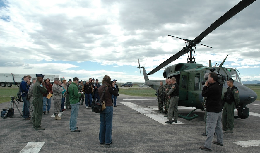 Members of the 40th Helicopter Squadron and the 341st Security Forces Group Tactical Response Force describe their role in the strategic deterrent mission and showcase their equipment during an open house for local elected officials and local news affiliates at Mike-01 June 13. (U.S. Air Force photo/Airman 1st Class Dillon White)