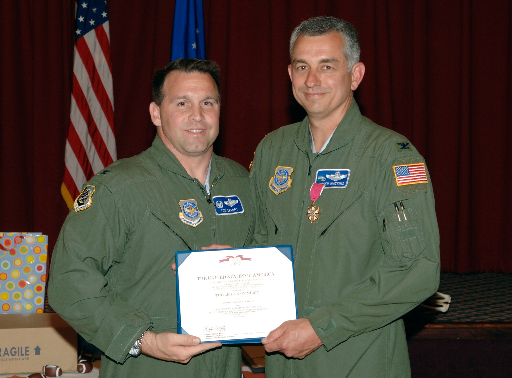 FAIRCHILD AIR FORCE BASE, Wash. – Col. Thomas Sharpy (left), 92nd Air Refueling Wing commander, and Col. Roger Watkins, 92nd Air Refueling Wing vice commander, pose for a photo after a medal presentation at Club Fairchild here June 14. Colonel Watkins was awarded the Legion of Merit for his service to the Fairchild community as the 92nd ARW vice commander. He has served as the wing vice commander since February 2007. (U.S. Air Force photo / Staff Sgt. Chad Watkins)
