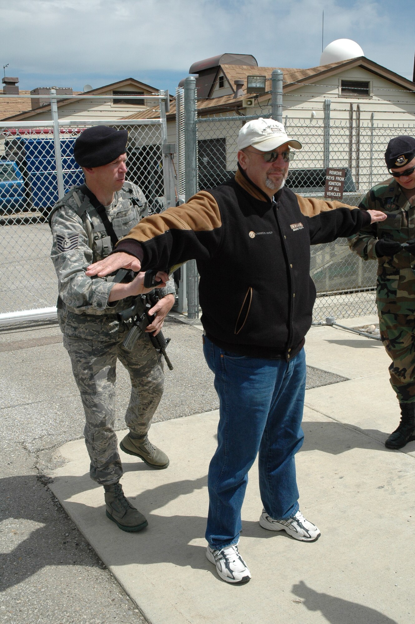 Tech. Sgt. Howard Smith, 341st Security Forces Squadron member, searches Ken Ronish, Fergus County commissioner, prior to entering Mike-01 for an open house June 13. (U.S. Air Force photo/Airman 1st Class Dillon White)