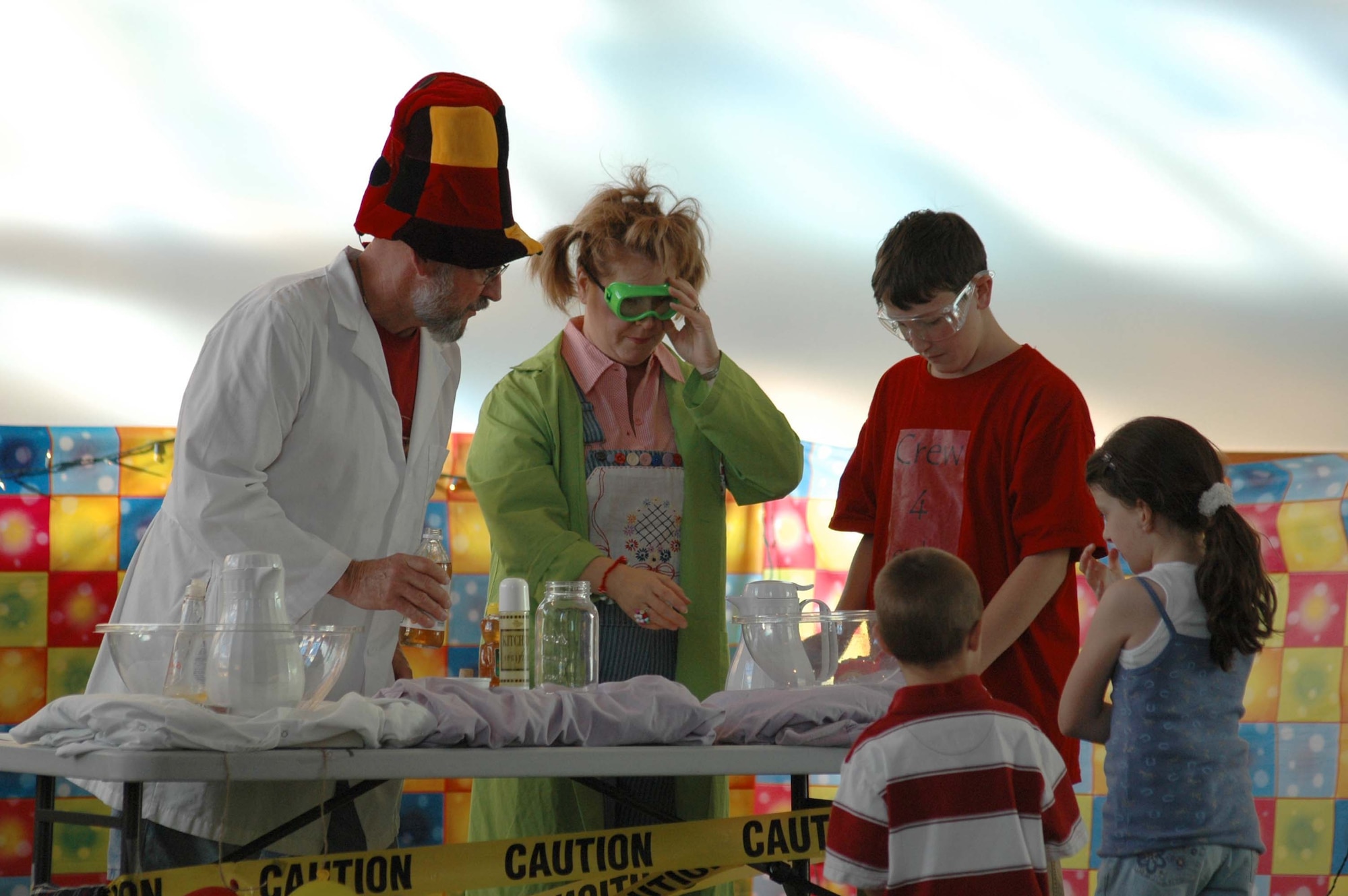 Vacation Bible School leaders and students conduct an experiment related to Bible lessons in the chapel sanctuary June 13. (U.S. Air Force photo/Airman 1st Class Dillon White)