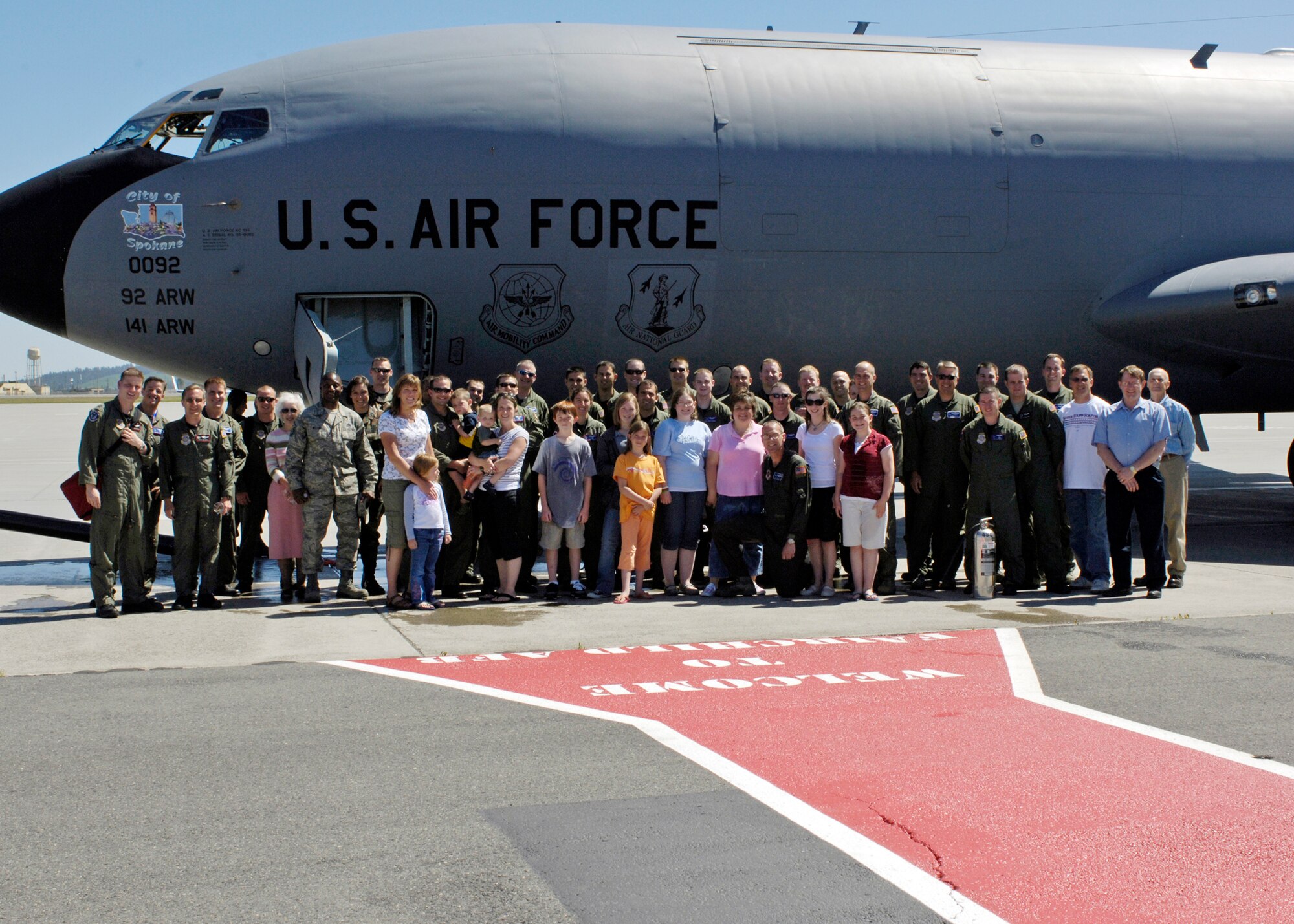 FAIRCHILD AIR FORCE BASE, Wash. – Col. Mark Melville, 92nd Operations Group commander, poses with a crowd of family and friends after taking his final KC-135 Stratotanker flight as the 92nd OG commander here June 16. (U.S. Air Force photo / Airman 1st Class Melissa Barnett)