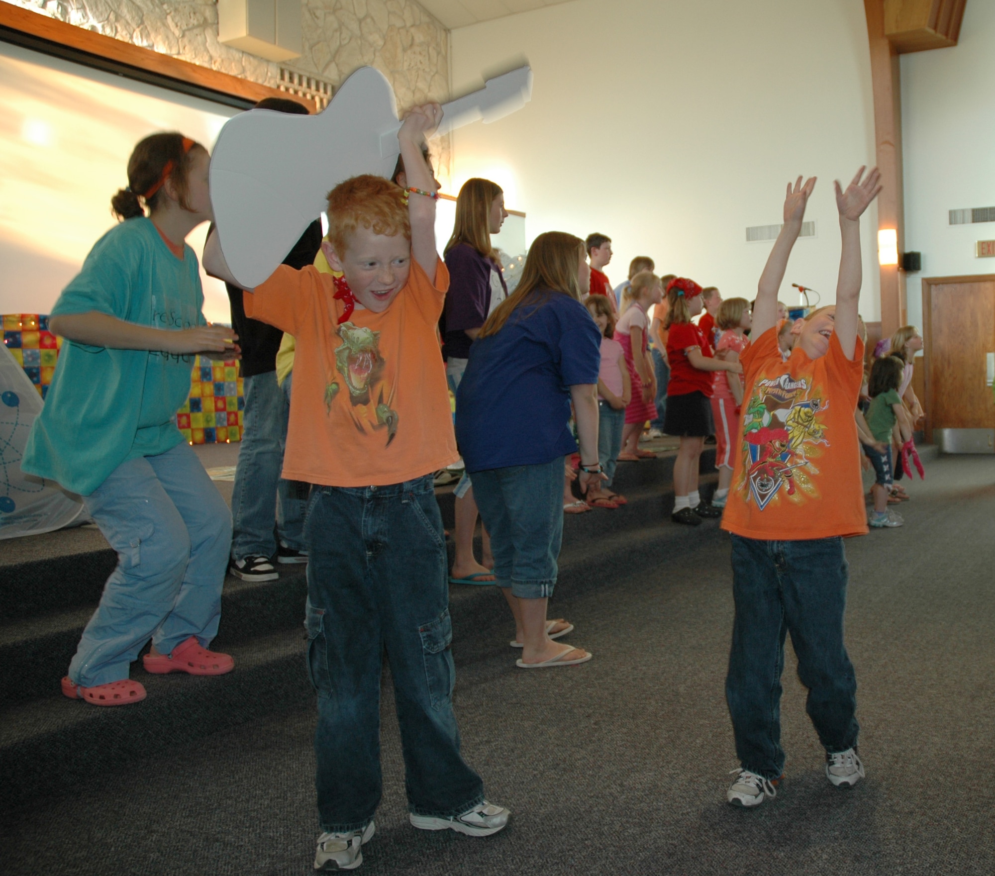 Vacation Bible School students sing and dance in the base chapel sanctuary during the five-day VBS finale. (U.S. Air Force photo/Airman 1st Class Dillon White)