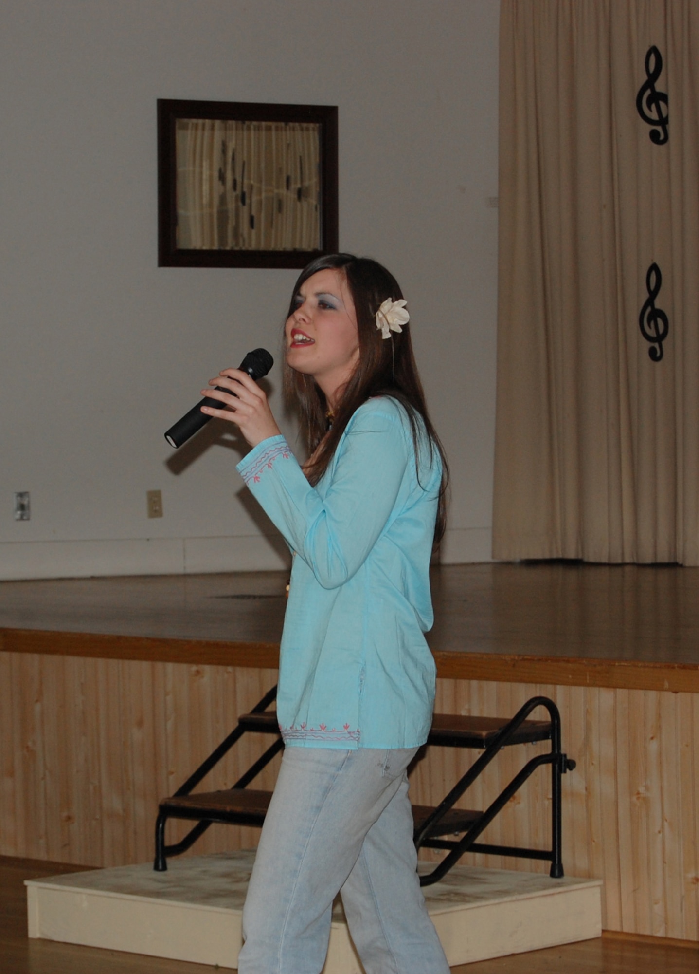 Airman 1st Class Jolene Bullock, 341st Missile Maintenance Squadron, performs "Son of a Preacher Man" during the Wing It Theater American Bandstand-like performance June 14. Airman Bullock continued to perform her selection acapella, after the music to her song cut out. The audience lent a hand by clapping to keep time. (U.S. Air Force photo/Airman 1st Class Emerald Ralston)
