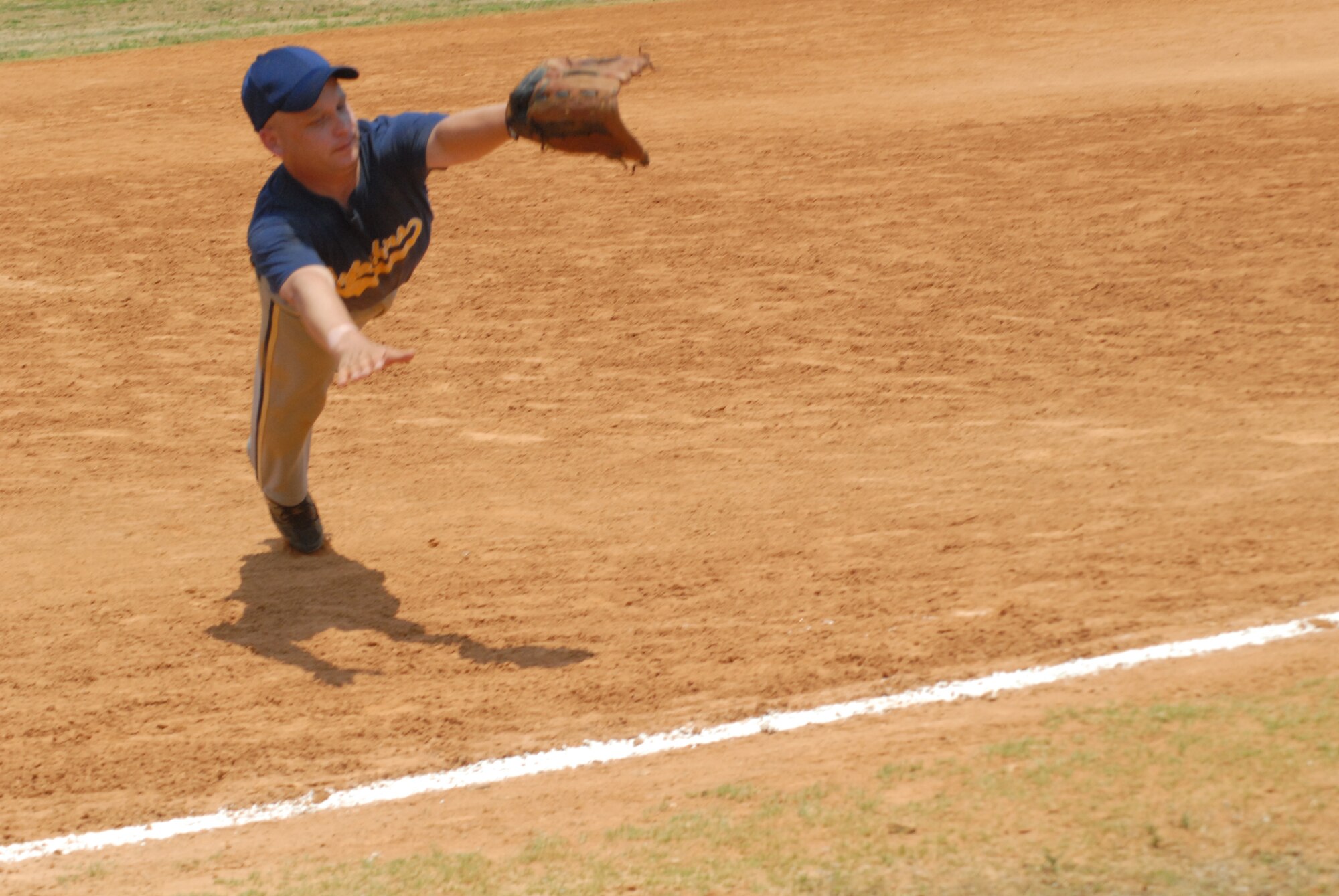 John Mellish, third baseman for the 43rd Security Forces Squadron Defenders, dives to make a catch during the Pope Intramural Softball Championship game June 13. (U.S. Air Force Photo by Irvin Gourdine)