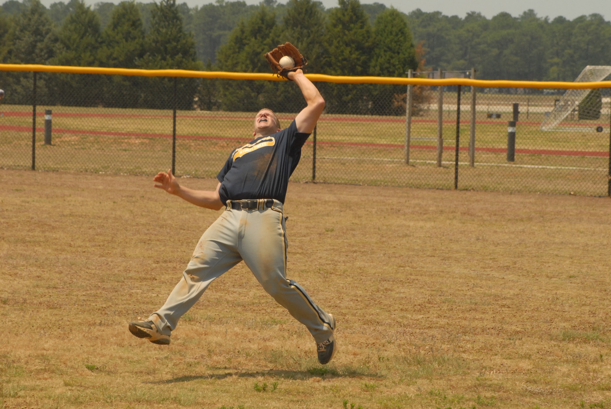 Adam Jessee, short stop for the 43rd Security Forces Squadron Defenders, makes a catch during the Pope Intramural Softball Championship game June 13. (U.S. Air Force Photo by Staff Sgt. Jon LaDue)