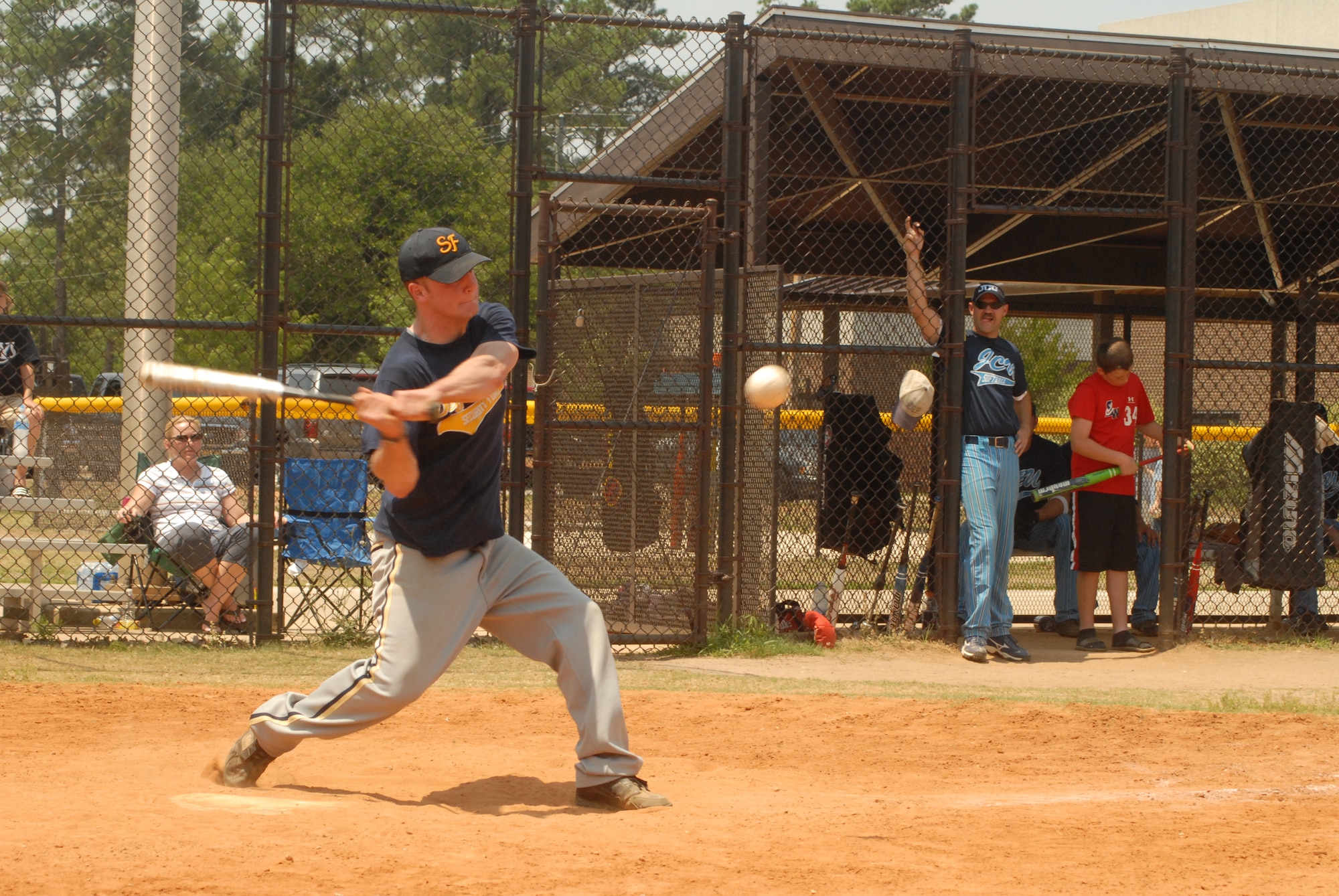 Dave Heilman, 43rd Security Forces Squadron Defenders left fielder, finishes his swing during the Pope Intramural Softball Championship game June 13. (U.S. Air Force Photo by Staff Sgt. Jon LaDue)