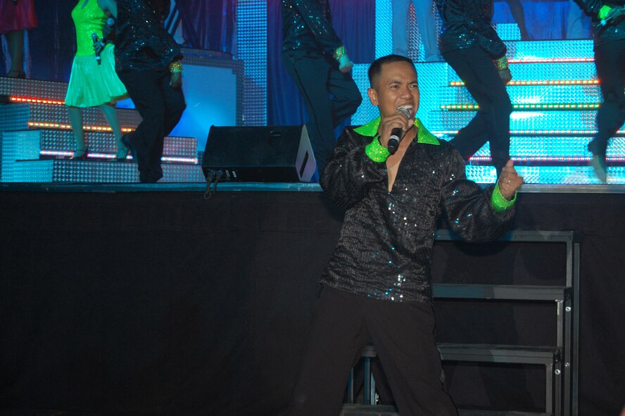 Staff Sgt. Oliver Dagum, passenger service supervisor with the 734th Air Mobility Squadron, Andersen Air Base, Guam, performs during Tops in Blue's "Deja Blue" show at the Montana Expo Park June 15. (U.S. Air Force photo/Airman 1st Class Emerald Ralston)