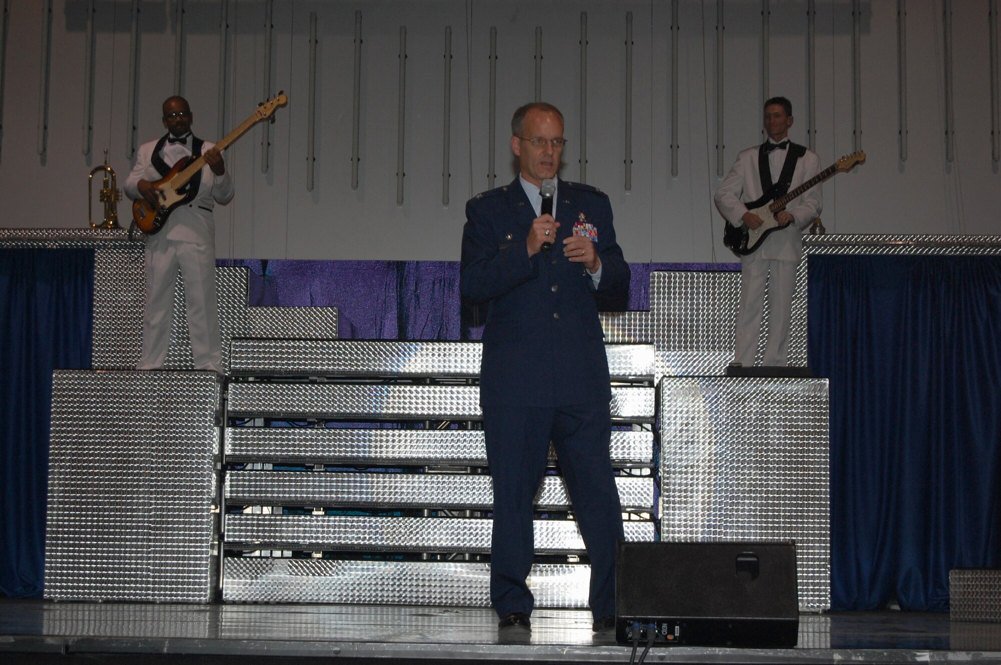 Col. Michael Fortney, 341st Space Wing commander, welcomes the crowd at the Montana Expo Park June 15 before Tops in Blue, the Air Force's expeditionary entertainers, took the stage to perform their "Deja Blue" show. (U.S. Air Force photo/Airman 1st Class Emerald Ralston)