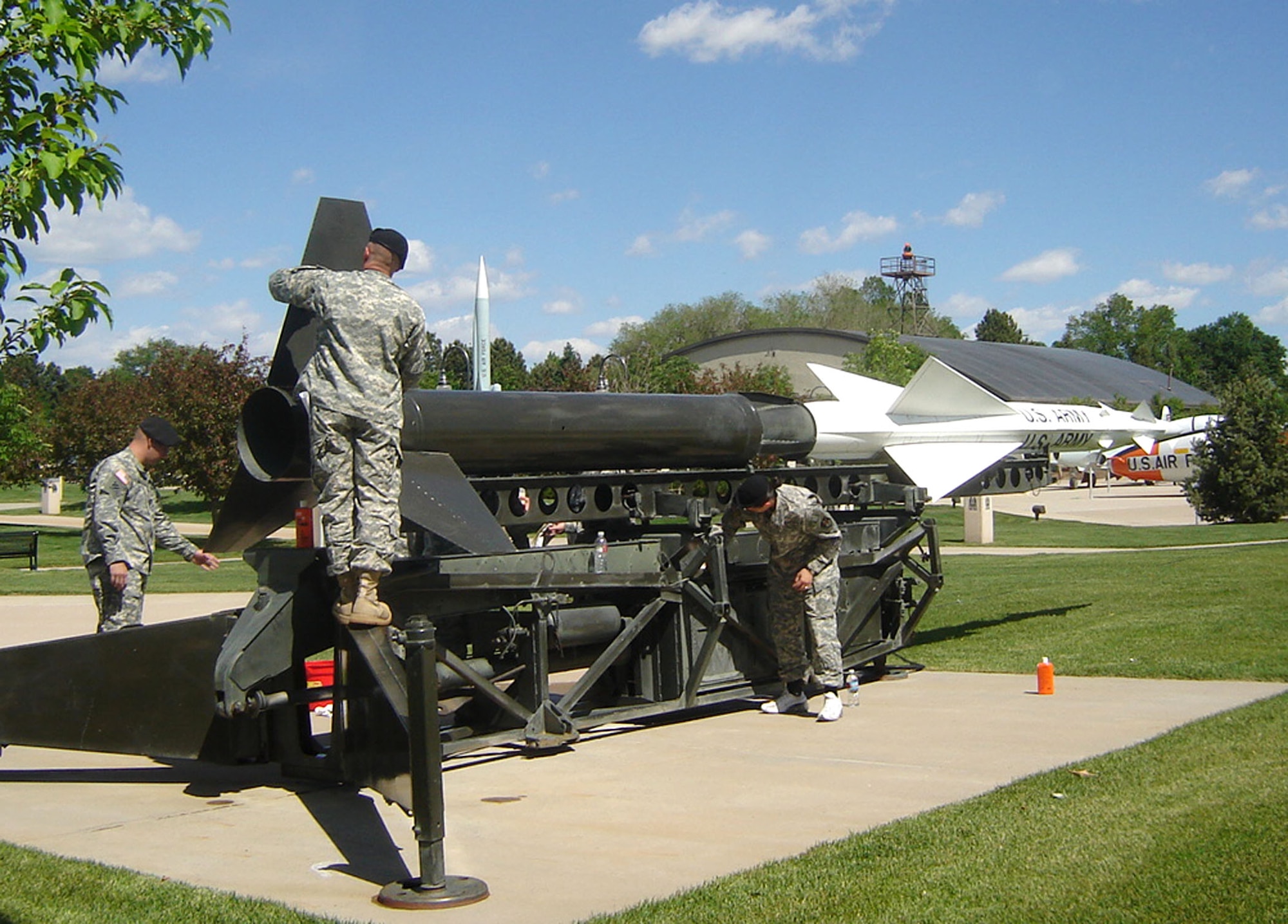 Soldiers from the 1st Space Company, 1st Space Battalion, participate in their first “Adopt-A-Missile” workday at the Peterson Air Force Base museum in Colorado. The Soldiers gave a much needed cleaning to the museum’s Nike Ajax surface to air missile display.  The Nike Ajax was the U.S. Army’s first operational guided SAM and saw service defending U.S. cities from air attack from 1954 to 1963. The 1st Space Battalion is assigned to the Army Space and Missile Defense Command at Peterson. Team Peterson organizations interested in adopting a museum aircraft or missile can contact Jeff Nash at 556-8314. (U.S. Air Force photo/Jeff Nash)