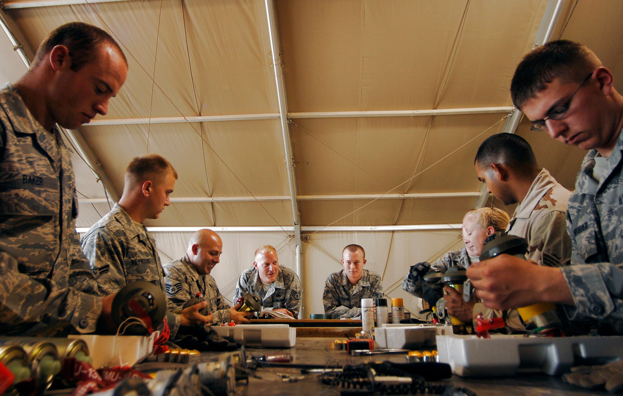 Munitions systems specialists assigned to the 332nd Expeditionary Maintenance Squadron at Joint Base Balad, Iraq, build fuses for guided bomb unit-12s June 16. The team is responsible for building, maintaining and storing various munitions to support Operation Iraqi Freedom kinetic strikes. The GBU-12 can self-guide to a target pinpointed by a laser designator. Since January, F-16 Fighting Falcons flown by the 332nd Expeditionary Operations Group have engaged in more than 315 kinetic strikes. (U.S. Air Force photo/Senior Airman Julianne Showalter) 