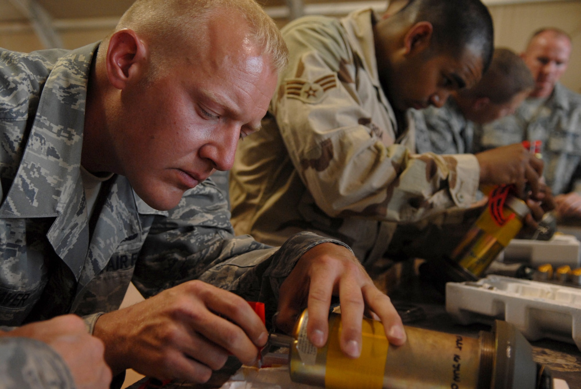 Staff Sgt. Dan Weaver pieces together a fuse for a guided bomb unit-12 June 16 at Joint Base Balad, Iraq. The team is responsible for building, maintaining and storing various munitions to support Operation Iraqi Freedom kinetic strikes. The fuse and its components detonate the munition and increase the force of the explosion; the GBU-12 can self-guide to a target pinpointed by a laser designator, which helps to minimize collateral damage resulting from detonation. Sergeant Weaver is a 332nd Expeditionary Maintenance Squadron munitions systems specialist deployed from Dover Air Force Base, Del. (U.S. Air Force photo/Senior Airman Julianne Showalter) 