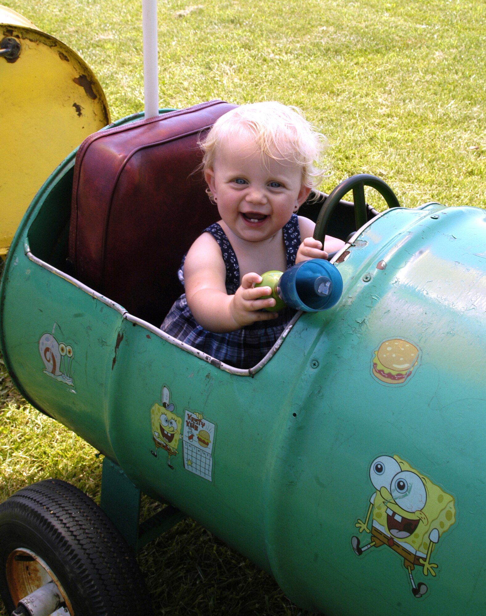 Liane Lawrence, daughter of Senior Airman Jean Lawrence, 436th Operations Support Squadron, has fun riding the train during the Wing Picnic June 13 at the Eagle’s Nest Picnic Area. (U.S. Air Force photo/Airman 1st Class Shen-Chia Chu)