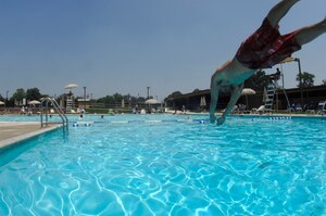 Airman 1st Class Alexander Sidawi, 744th Communications Squadron radio maintenance apprentice, takes a dip in the base pool June 7. There have been many upgrades to the base pool to include a new bath house, helping to create an even more comfortable environment.