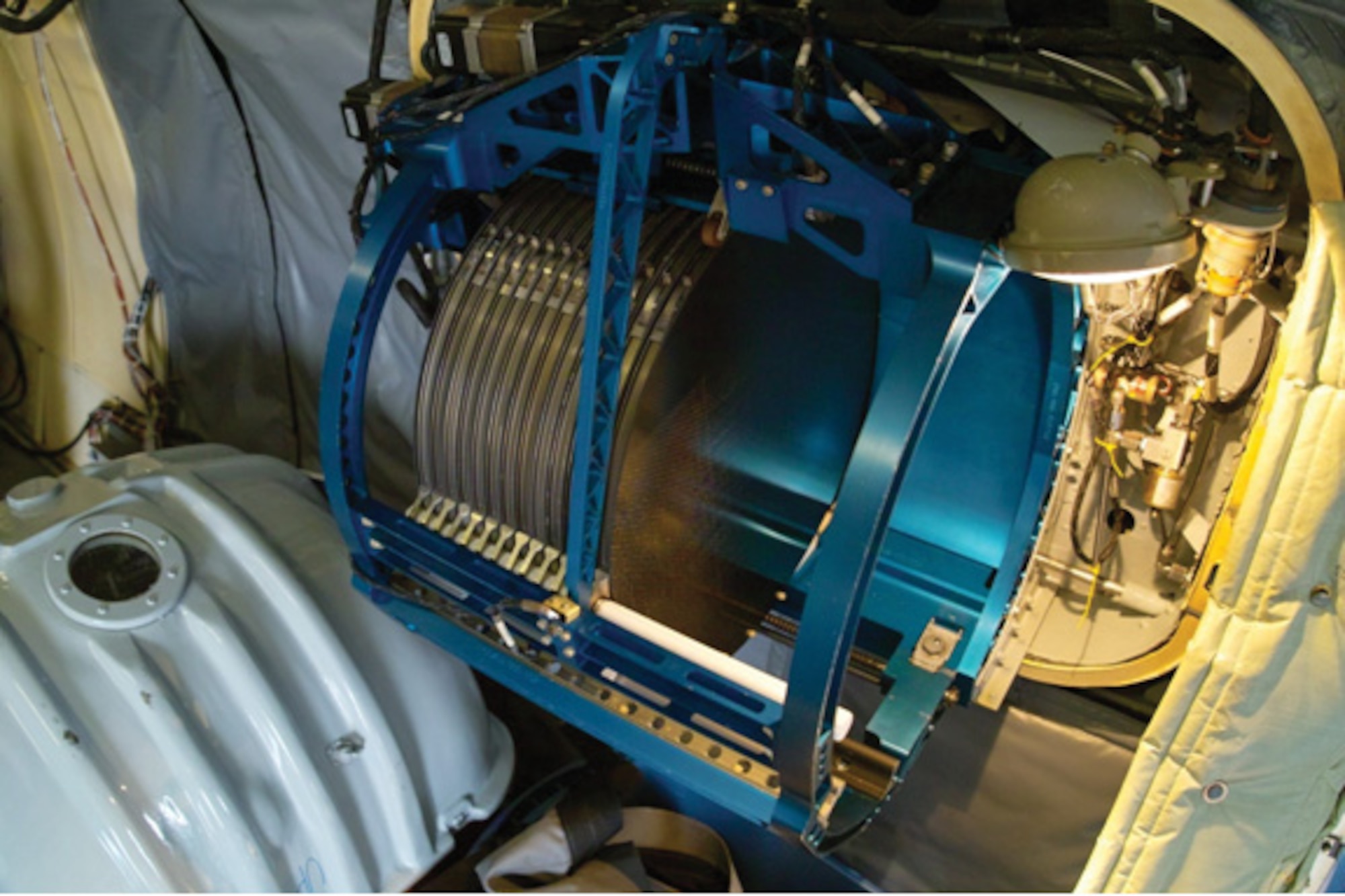U1B foils are essentially “pods” on the outside of the aircraft which allow laminar air flow to pass through 13” filter papers.  Shown here is the interior section that houses the individual filter papers, and like an old fashioned jukebox, places the filters in the airstream one at a time. (U.S. Air Force photo by Master Sgt. Steven Clark)