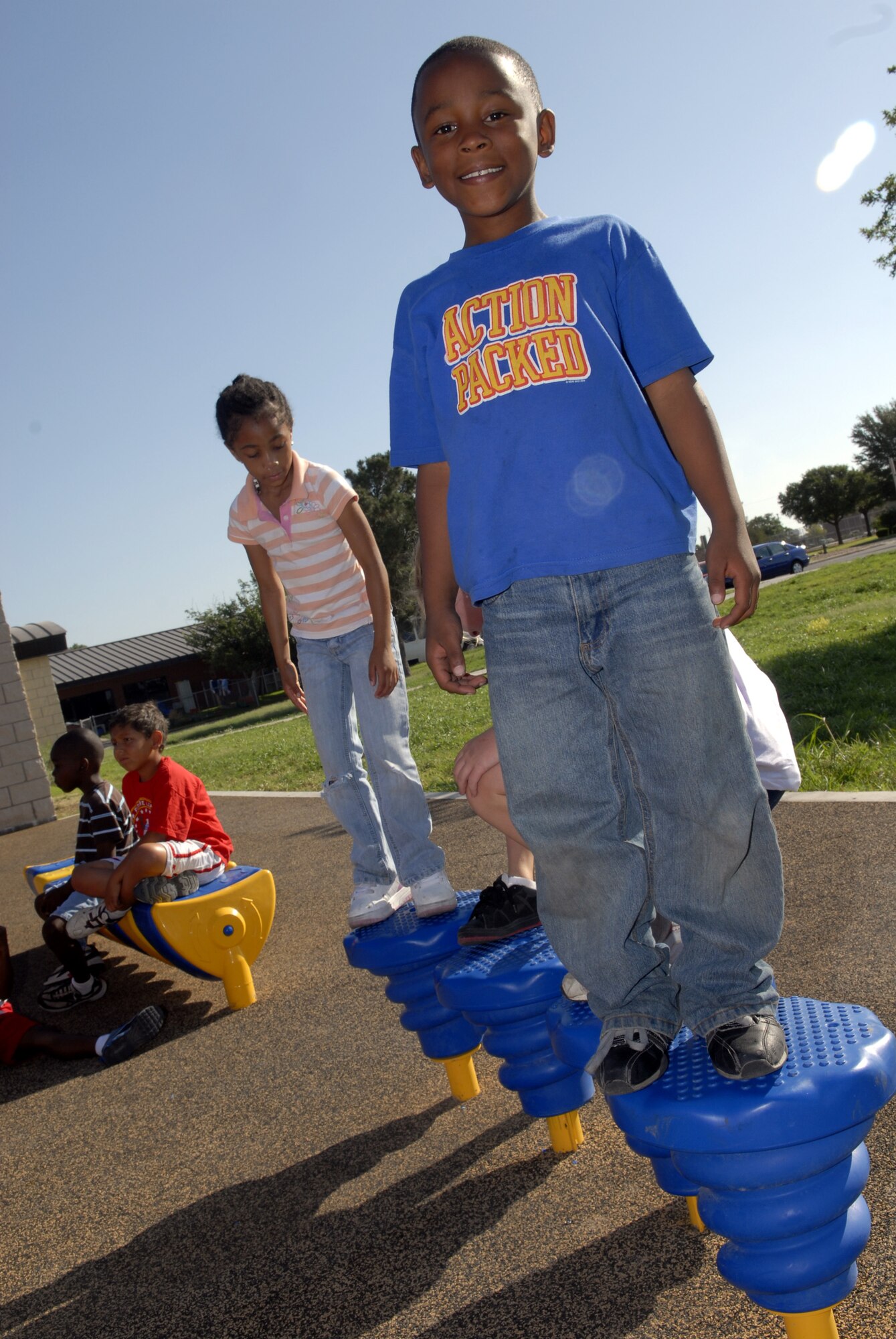 Demarcus Cobb, 8, enjoys the newly expanded outdoor play area at the school-age facility on Goodfellow. (U.S. Air Force photo by Senior Airman Kamaile Chan)