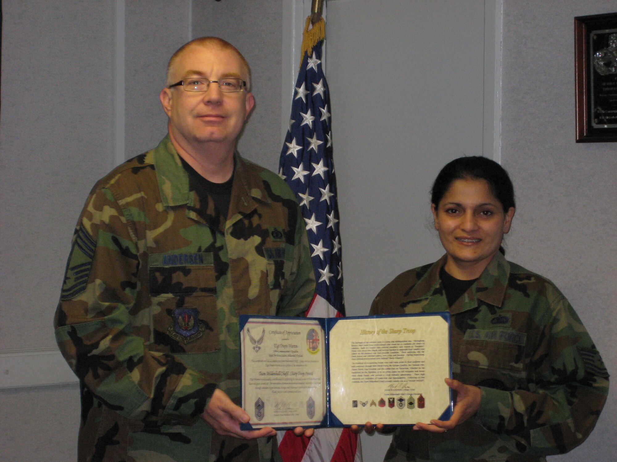 Tech. Sgt. Trupti Warren, 100th Air Refueling Wing, receives her Mildenhall Chiefs Group “Sharp Troop” Award from Chief Master Sgt. Bill Andersen. (courtesy photo)
