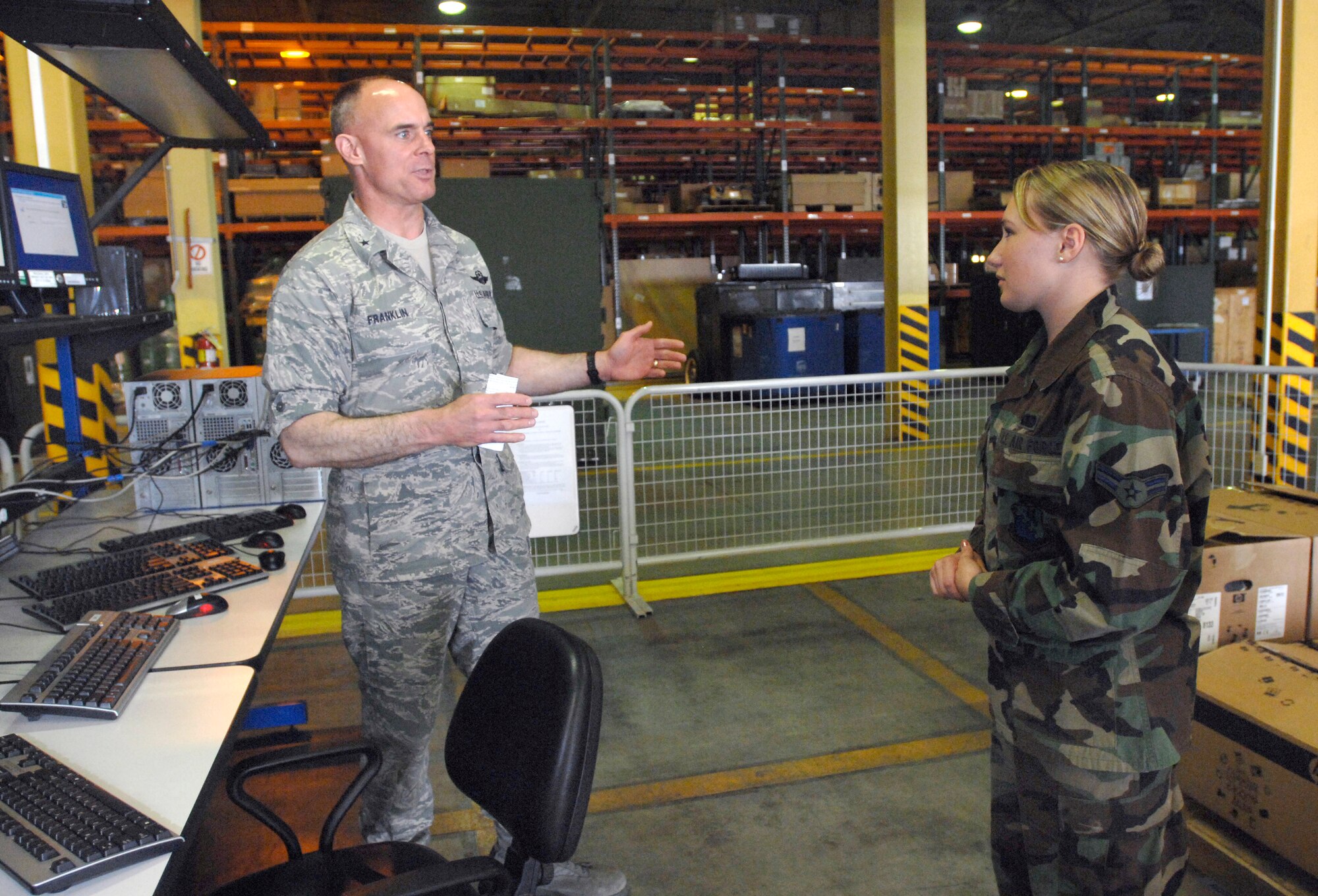 AVIANO AIR BASE, Italy --  31st Fighter Wing commander, Brig. Gen. Craig Franklin, asks Airman 1st Class Ashley Coddington questions about the new process of installing computer patches May 23.   (U.S. Air Force photo/Airman 1st Class Ashley Wood)  