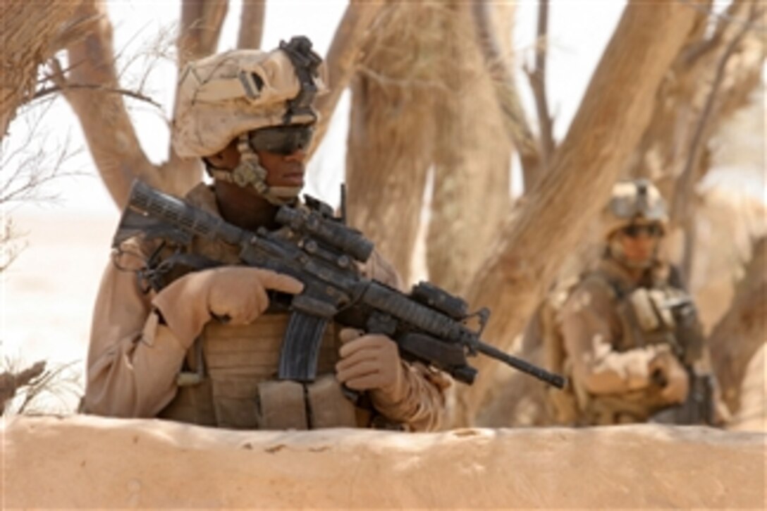 U.S. Marines from 1st Platoon, Alpha Company, 2nd Light Armored Reconnaissance, Task Force Mechanized stand guard in the Salah Ad Din Province, Iraq, on May 20, 2008.  The Marines are conducting missions to hunt down and rid the northern part of Iraq of insurgents.  