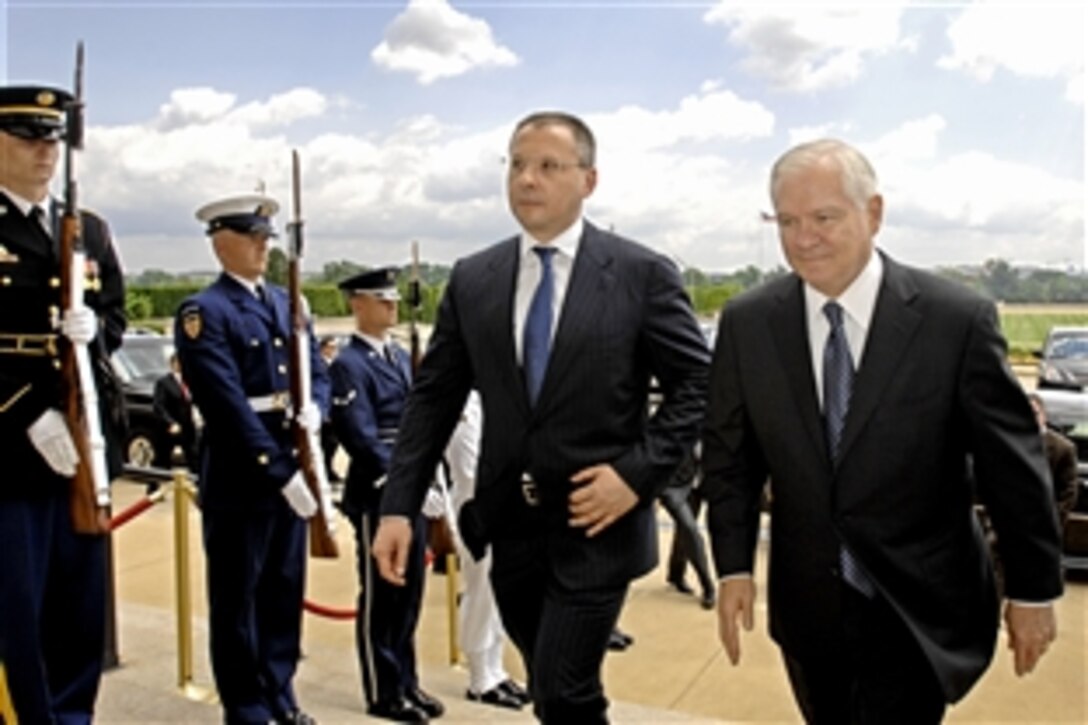 Defense Secretary Robert M. Gates, right, escorts Bulgarian Prime Minister Sergei Stanishev through a cordon of honor guards and into the Pentagon in Washington, D.C., June 17, 2008.  Gates and Stanishev met to discuss a broad range of security issues.  