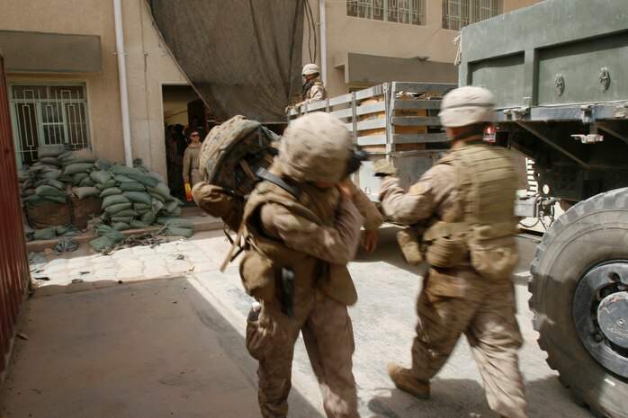 FALLUJAH, Iraq â?? Company K, 3rd Battalion, 6th Marines detach from Joint Security Station Khadairy in the northern district of Fallujah, June 18. The movement means the building is now solely an Iraqi Police station and the transition of security is relinquished to IPs who must keep the security strong in Fallujah. (Official U.S. Marine Corps photo by Cpl. Chris Lyttle) (RELEASED)