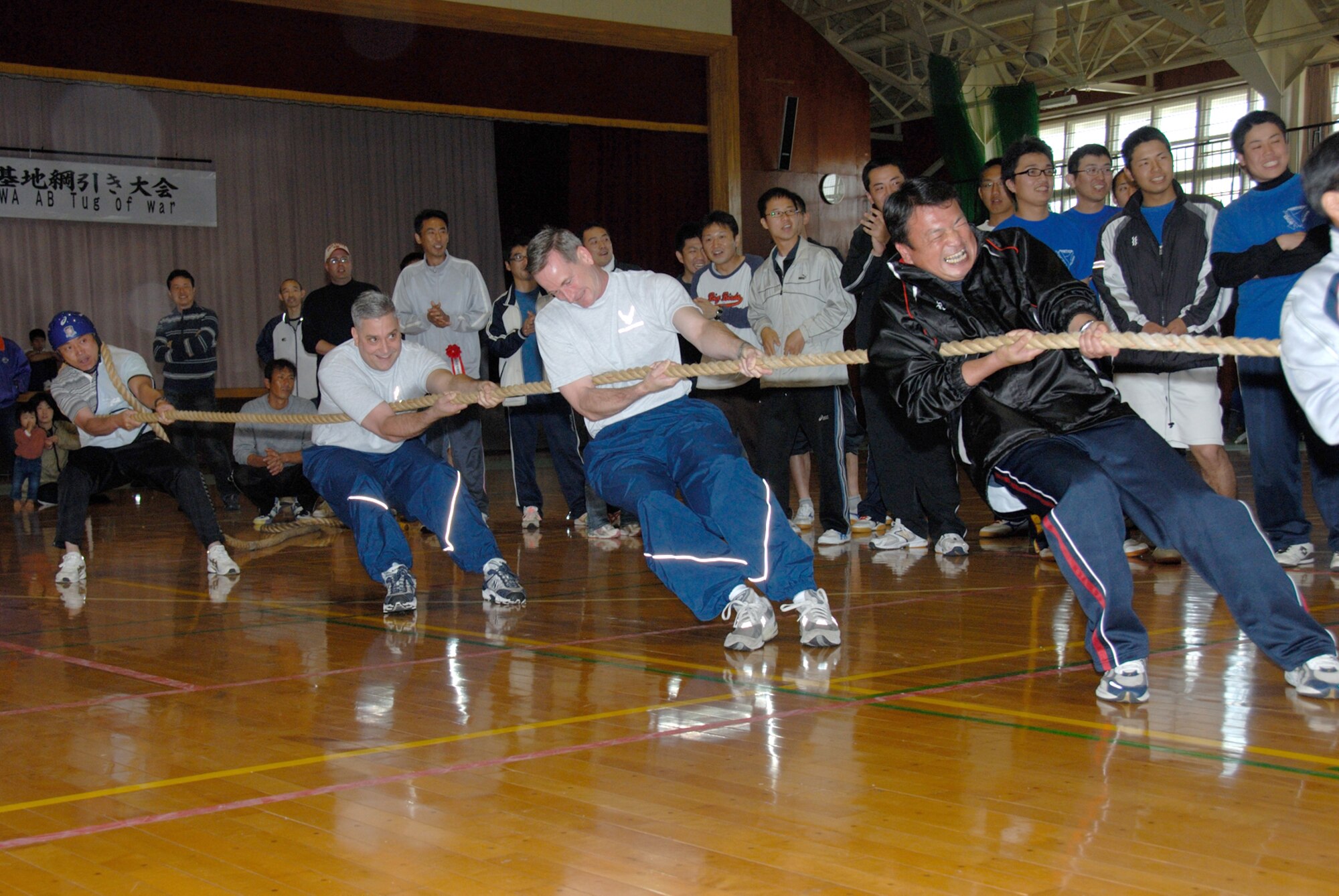 MISAWA AIR BASE, Japan -- Chief Master Sgt. Ricky Price, 35th Fighter Wing command chief, and Col. T.J. O'Shaughnessy, 35th Fighter Wing commander, team up with VIPs and Japan Air Self Defense Force Senior NCOs during the 7th annual tug-of-war competition on June 14, 2008.  The Northern Air Defense Force/ Commanders Cup Tug-of-War competition is held annually to support and strengthen U.S. and Japanese relations.  (U.S. Air Force photo by Senior Airman Laura R. McFarlane)