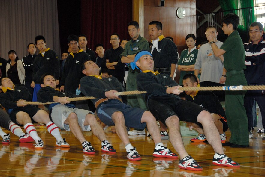 MISAWA AIR BASE, Japan -- Team Hawkeye strain to go all the way during the 7th annual tug-of-war competition on June 14, 2008.  Team Hawkeye consisted of members from the Japan Air Self Defense Force, Airborne Early Warning Group.  Team Hawkeye took second place in the competition.  The Northern Air Defense Force/ Commanders Cup Tug-of-War competition is held annually to support and strengthen U.S. and Japanese relations.  (U.S. Air Force photo by Senior Airman Laura R. McFarlane)
