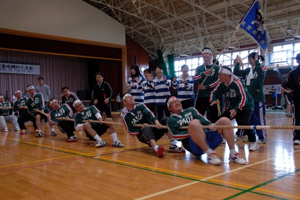 MISAWA AIR BASE, Japan -- Team Northern Stars tug their way to a win during the 7th annual tug-of-war competition on June 14, 2008.  Team Northern Stars consisted of members from the Northern Air Defense Force Head Quarters.  The Northern Air Defense Force/ Commanders Cup Tug-of-War competition is held annually to support and strengthen U.S. and Japanese relations.  (U.S. Air Force photo by Senior Airman Laura R. McFarlane)
