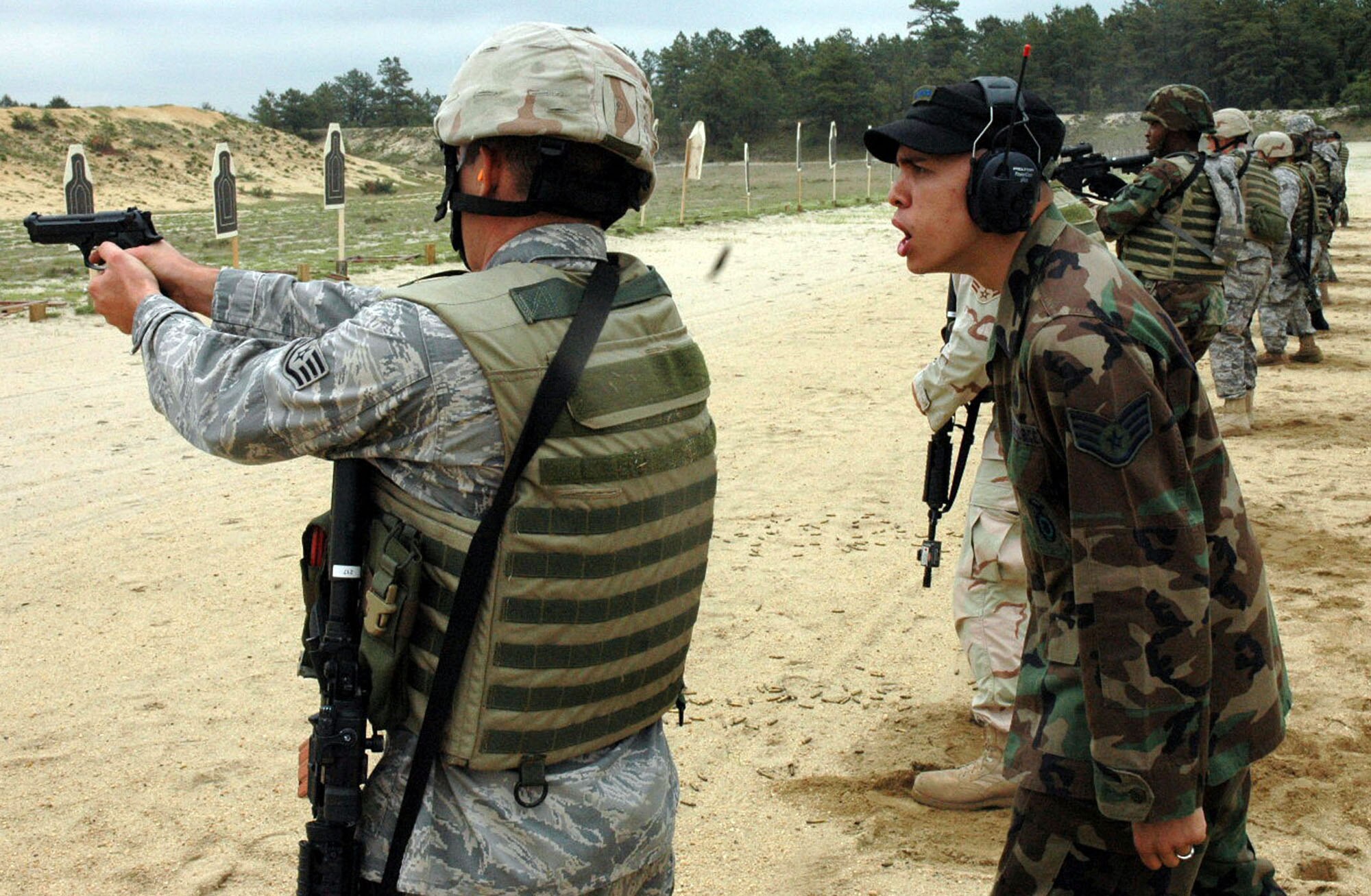 Staff Sgt. Brian Arrington watches students in the Air Force Phoenix Warrior Training Course practice live-fire combat rifle training June 5 at Fort Dix, N.J. The course prepares security forces Airmen for upcoming deployments.  Sergeant  Arrington is an instructor from the U.S. Air Force Expeditionary Center's 421st Combat Training Squadron. (U.S. Air Force Photo/Staff Sgt. Paul Evans) 