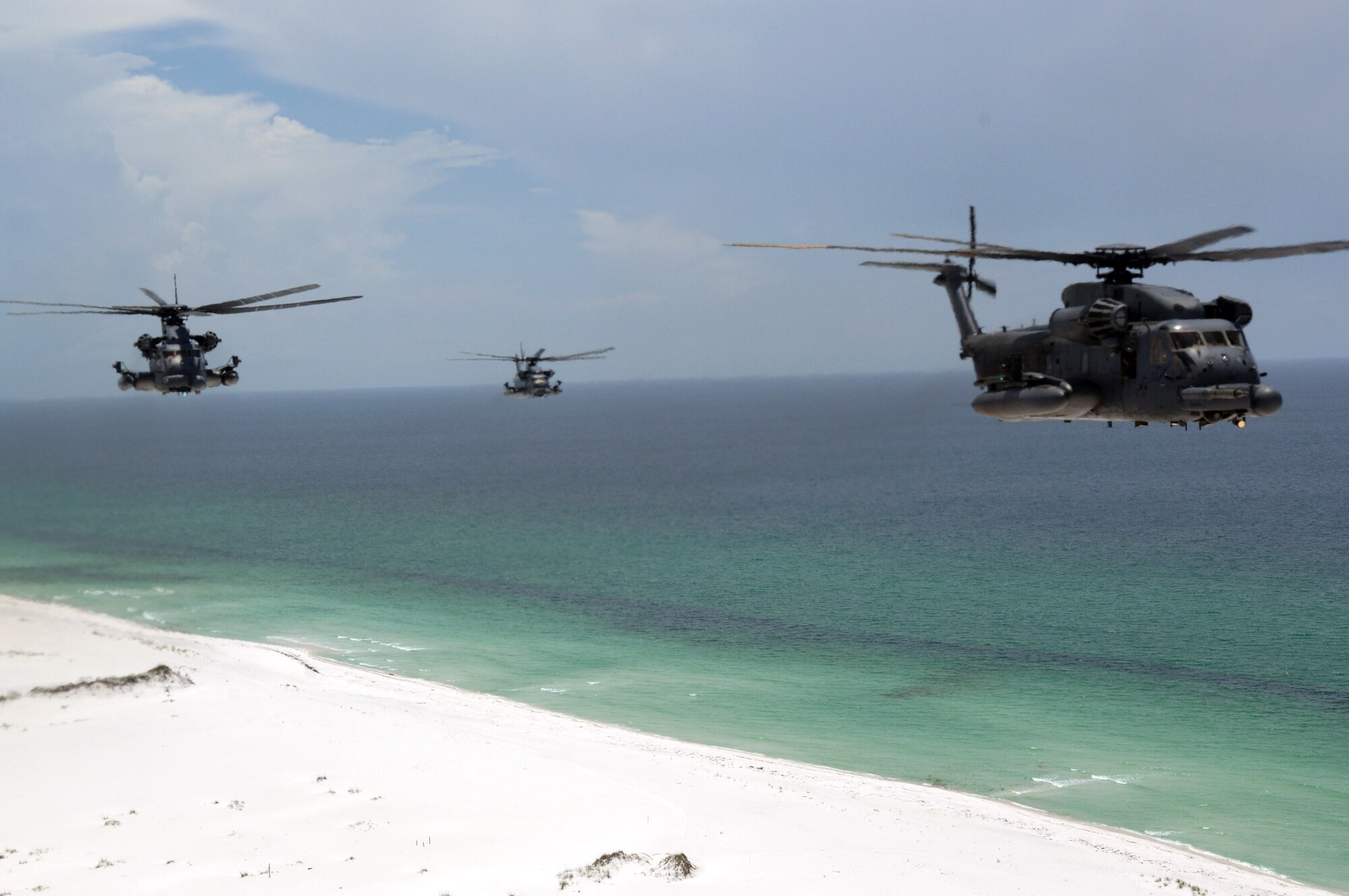 MH-53 Pave Low helicopters from the 20th Special Operations Squadron at Hurlburt Field, Fla., fly over a live-fire range June 12 at Eglin Air Force Base, Fla. The medium-lift helicopter is the largest, most powerful and technologically advanced helicopter in the Air Force inventory. (U.S. Air Force photo/Senior Airman Emily Moore) 