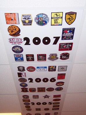 The patches from Specialized Undergraduate Pilot Training classes line the ceiling tiles of the 48th Flying Training Squadron's heritage room for each year of training. (U.S. Air Force photo by Sonic Johnson)