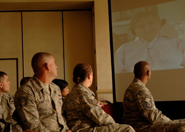 Members from Team Charleston watch a video of retired Brig. Gen. Thomas Mikolajcik speaking about the C-17 at the club on Charleston AFB June 14. More than 300 team Charleston members attended the general officers panel for the C-17 15th anniversary of the C-17. (U.S. Air Force photo/Airman 1st Class Katie Gieratz) 
