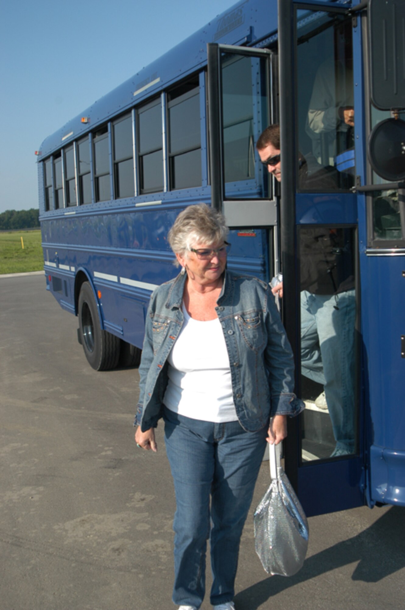 GRISSOM AIR RESERVE BASE, Ind., --  Civic leaders step off the bus and prepare to head into base operations during a visit to Grissom on June 18.  Nineteen civic leaders visited the base and participated in a special KC-135R Stratotanker flight. Base operations was the final stop prior to heading to the flightline and the aircraft.  (U.S. Air Force photo/Senior Airman Carl Berry)