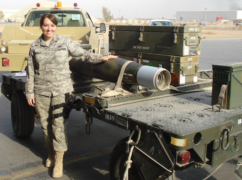 MINOT AIR FORCE BASE, N.D. – First Lieutenant Karen M. Gabriele, 5th Munitions Squadron systems flight commander and recent Acquisition and Logistics Experience Exchange Tour selectee, stands next to a munitions trailer while stationed in Balad, Iraq.  Lieutenant Gabriele is one of five officers recently chosen from across the Air Force for the ALEET assignment. ALEET is a career-broadening exchange program that allows maintenance officers to experience an acquisition tour with a guaranteed return to the maintenance career field. (Courtesy photo)